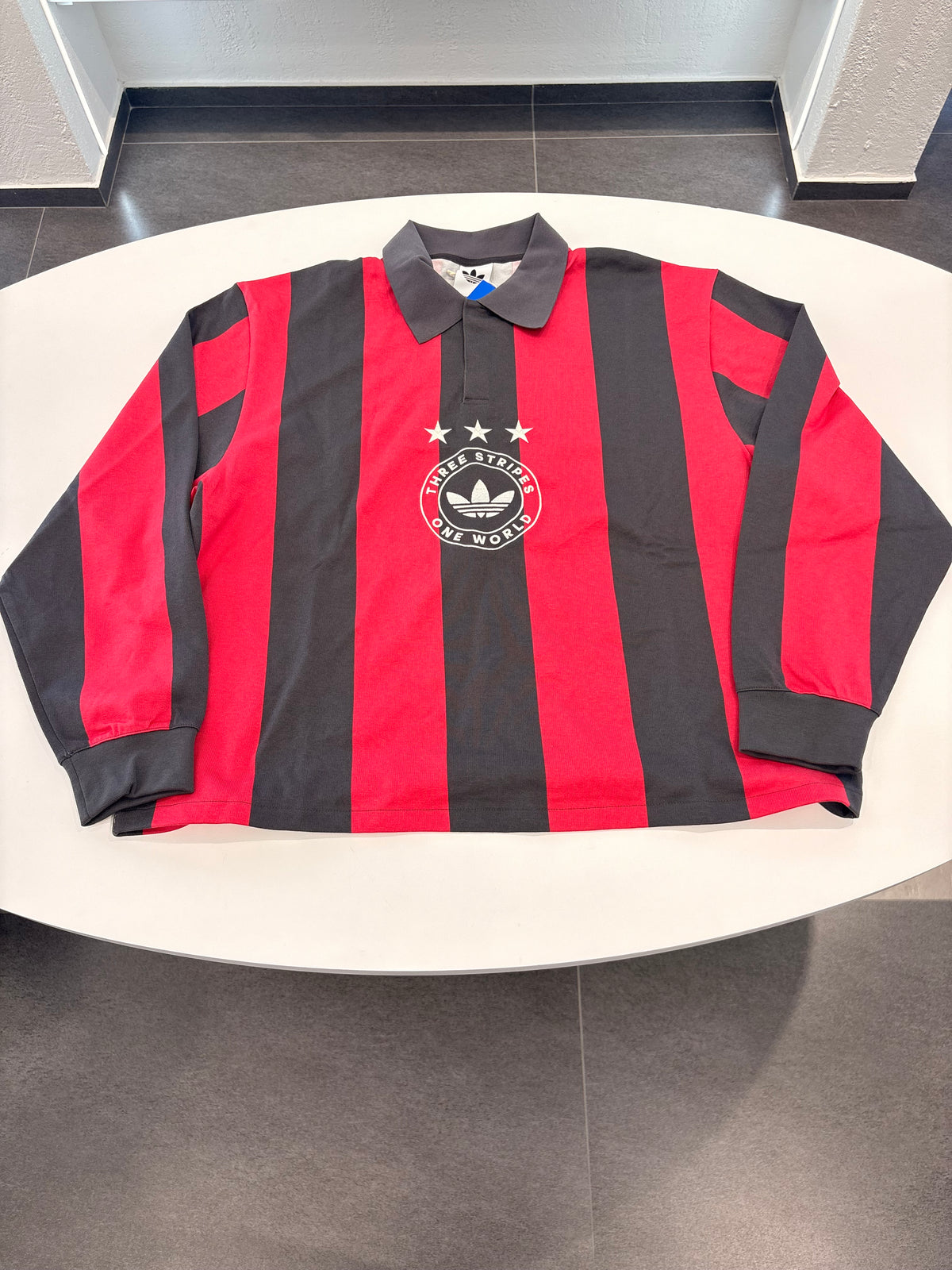 Polo Adidas a righe slavate nero