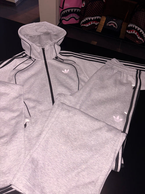 Tuta Adidas uomo grigia con zip logo retroriflettente