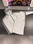 Tuta Adidas uomo grigia con zip logo retroriflettente